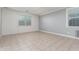 Bright and open second living space with tile floors, recessed lights, and two windows at 716 W Blue Ridge Dr, San Tan Valley, AZ 85140