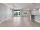 Spacious living room featuring tile floors, neutral paint, recessed lighting, ceiling fan, and sliding glass doors to back yard at 716 W Blue Ridge Dr, San Tan Valley, AZ 85140