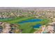 Aerial view of a stunning golf course community with lush green fairways and tranquil lakes at 7445 E Eagle Crest Dr # 1145, Mesa, AZ 85207