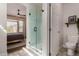 Bright bathroom features a glass shower with patterned tile floors near the main bedroom at 7445 E Eagle Crest Dr # 1145, Mesa, AZ 85207