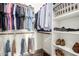 Organized walk-in closet with clothing racks and shelving for shoes and personal items at 7445 E Eagle Crest Dr # 1145, Mesa, AZ 85207