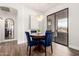 Elegant dining room with a round table, plush velvet chairs, and a stylish chandelier for gatherings at 7445 E Eagle Crest Dr # 1145, Mesa, AZ 85207