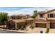 The community offers homes with stone accents, tile roofs, and attached garages at 7445 E Eagle Crest Dr # 1145, Mesa, AZ 85207