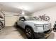 Spacious two car garage with Rivian EV, bikes and storage systems in a clean organized space at 7445 E Eagle Crest Dr # 1145, Mesa, AZ 85207