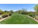 Scenic view of the lush green golf course, perfect for a relaxing day of play at 7445 E Eagle Crest Dr # 1145, Mesa, AZ 85207