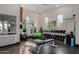 Well-equipped gym featuring free weights, exercise balls, and ample natural light from multiple windows at 7445 E Eagle Crest Dr # 1145, Mesa, AZ 85207