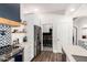 Modern kitchen with stainless steel refrigerator and accents, leading to the laundry area, providing convenience at 7445 E Eagle Crest Dr # 1145, Mesa, AZ 85207