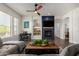 This living room is bright and airy, offering dark wood floors and modern finishes at 7445 E Eagle Crest Dr # 1145, Mesa, AZ 85207