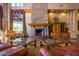 Cozy lobby area featuring a stone fireplace, comfortable leather seating, and natural light at 7445 E Eagle Crest Dr # 1145, Mesa, AZ 85207