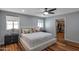 Well-lit bedroom featuring wood floors and closet with built-in shelving at 7643 E Rancho Vista Dr, Scottsdale, AZ 85251