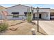 Inviting front yard with desert landscaping, river rock drainage, and mature Saguaro cactus at 7643 E Rancho Vista Dr, Scottsdale, AZ 85251