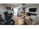 Spacious living room featuring modern furniture, a ceiling fan and an open floor plan at 7643 E Rancho Vista Dr, Scottsdale, AZ 85251