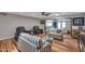 Comfortable living room with striped sofas, wooden floors, and an open layout at 7643 E Rancho Vista Dr, Scottsdale, AZ 85251