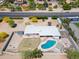 Expansive backyard with pool, basketball court, fire pit, and low-maintenance landscaping at 7667 E Cactus Rd, Scottsdale, AZ 85260