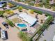Aerial view featuring home, pool, patio with fire pit and property boundaries nestled in mature landscaping at 7667 E Cactus Rd, Scottsdale, AZ 85260