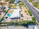 Aerial view of the property highlighting boundaries, pool, mature landscaping and desert style living at 7667 E Cactus Rd, Scottsdale, AZ 85260