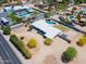 Expansive property featuring a pool, ample parking, and a unique modern home design in a sunny locale at 7667 E Cactus Rd, Scottsdale, AZ 85260