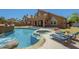 Expansive backyard featuring a sparkling pool, spa, patio, and spiral staircase leading to a balcony at 768 E Mountain Sky Ave, Phoenix, AZ 85048