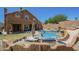 Exterior view of the backyard featuring a sparkling pool, patio, and built-in barbeque at 768 E Mountain Sky Ave, Phoenix, AZ 85048