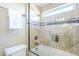 Bathroom features a tile shower with glass door, a built-in shelf, and tile flooring at 768 E Mountain Sky Ave, Phoenix, AZ 85048