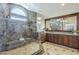 Luxurious primary bathroom features a marble glass shower, granite counters, and dual sinks at 768 E Mountain Sky Ave, Phoenix, AZ 85048
