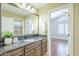 Bathroom showcasing a vanity with granite countertop, undermount sink, and a large mirror at 768 E Mountain Sky Ave, Phoenix, AZ 85048