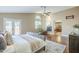 Bedroom with access to the backyard, ensuite bathroom, natural light, vaulted ceilings, and ceiling fan at 768 E Mountain Sky Ave, Phoenix, AZ 85048
