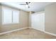 Comfortable bedroom with neutral paint, tile floors, ceiling fan, and window with shutters at 768 E Mountain Sky Ave, Phoenix, AZ 85048