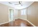 Inviting bedroom with a ceiling fan, hardwood floors, and a window with white shutters at 768 E Mountain Sky Ave, Phoenix, AZ 85048