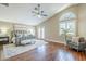Spacious bedroom featuring vaulted ceilings, stylish ceiling fan, wood floors, and ample natural light at 768 E Mountain Sky Ave, Phoenix, AZ 85048