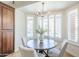 Charming breakfast nook with plantation shutters, a modern chandelier, and a cozy round table at 768 E Mountain Sky Ave, Phoenix, AZ 85048