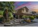 Charming two-story home with well-manicured landscaping, inviting curb appeal, and a beautiful desert sunset at 768 E Mountain Sky Ave, Phoenix, AZ 85048