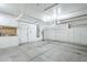 Clean and spacious garage featuring overhead storage racks and built-in cabinets for organization at 768 E Mountain Sky Ave, Phoenix, AZ 85048
