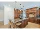 Chef's kitchen featuring custom cabinets, granite countertops, and a suite of high-end appliances at 768 E Mountain Sky Ave, Phoenix, AZ 85048