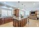 Spacious kitchen with custom cabinetry, granite counters, and an island open to the living room at 768 E Mountain Sky Ave, Phoenix, AZ 85048