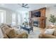 Cozy living room featuring a fireplace and french doors to the exterior at 768 E Mountain Sky Ave, Phoenix, AZ 85048