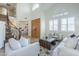 Bright and airy living room with high ceilings, neutral decor, and a wrought iron staircase at 768 E Mountain Sky Ave, Phoenix, AZ 85048