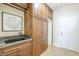 Well-organized mud room with custom cabinets, granite countertop, sink, and storage space by the door at 768 E Mountain Sky Ave, Phoenix, AZ 85048