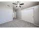 Bedroom featuring a ceiling fan and closet with sliding doors at 8017 W Eugie Ave, Peoria, AZ 85381