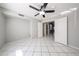 Bedroom with tile floors, ceiling fan and large doors for easy access to other areas at 8017 W Eugie Ave, Peoria, AZ 85381