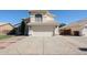 Two-story home featuring a well-manicured lawn and a two-car garage in a sunny neighborhood at 8017 W Eugie Ave, Peoria, AZ 85381