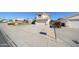 Residential street featuring well-maintained homes and driveways, showcasing a suburban neighborhood at 8017 W Eugie Ave, Peoria, AZ 85381