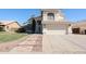 Charming two-story home with a well-kept lawn and a wide driveway leading to a two-car garage at 8017 W Eugie Ave, Peoria, AZ 85381