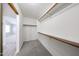 Carpeted walk-in closet with built-in shelving at 8017 W Eugie Ave, Peoria, AZ 85381