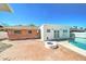 Private backyard featuring a brick patio, sparkling pool, and additional seating area at 8220 E Montecito Ave, Scottsdale, AZ 85251