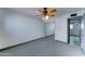 Bedroom features a ceiling fan and closet with sliding mirror doors at 8220 E Montecito Ave, Scottsdale, AZ 85251