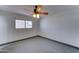 Bedroom with a ceiling fan and window at 8220 E Montecito Ave, Scottsdale, AZ 85251