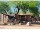 Charming single-story home featuring a desert-landscaped yard and mature trees at 8220 E Montecito Ave, Scottsdale, AZ 85251