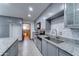 Well-lit kitchen features grey cabinetry, stainless steel appliances, and subway tile backsplash at 8220 E Montecito Ave, Scottsdale, AZ 85251