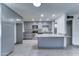 Spacious kitchen features grey cabinetry, stainless steel appliances, granite countertops and island at 8220 E Montecito Ave, Scottsdale, AZ 85251